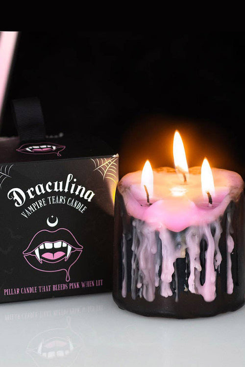 pink and black bleeding wax candle