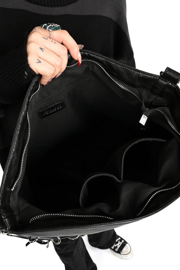 black strapped buckled black large slouchy bag with inner pouches