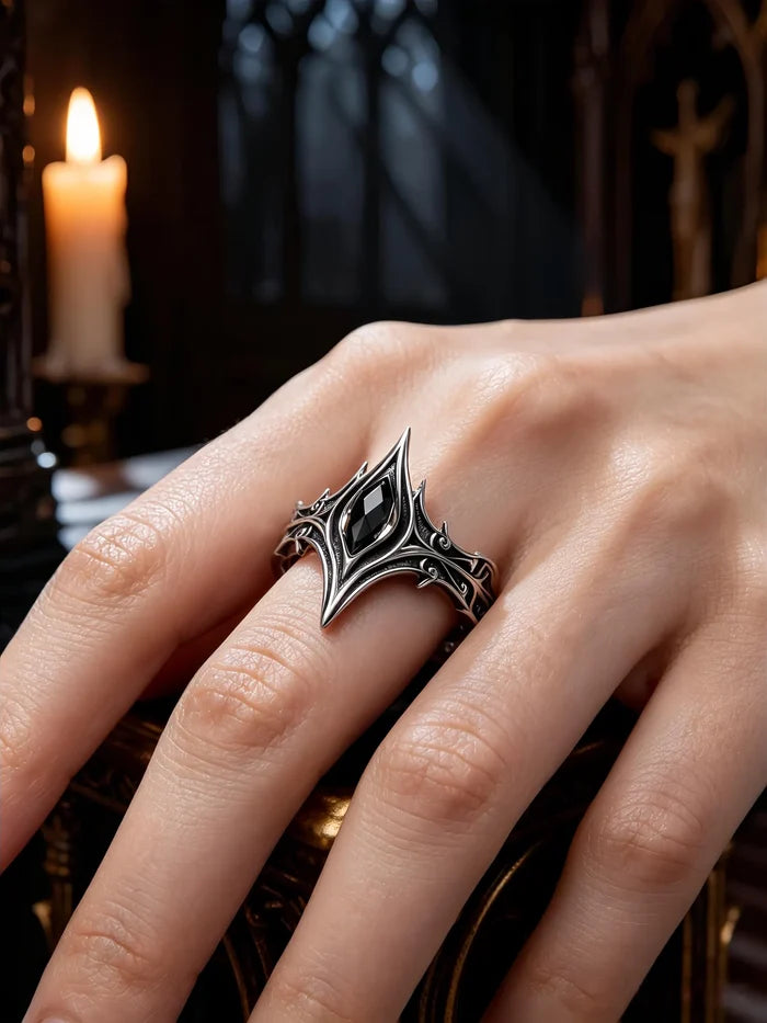 Hand wearing gothic cathedral chevron ring with black onyx — alternative wedding band in 925 silver