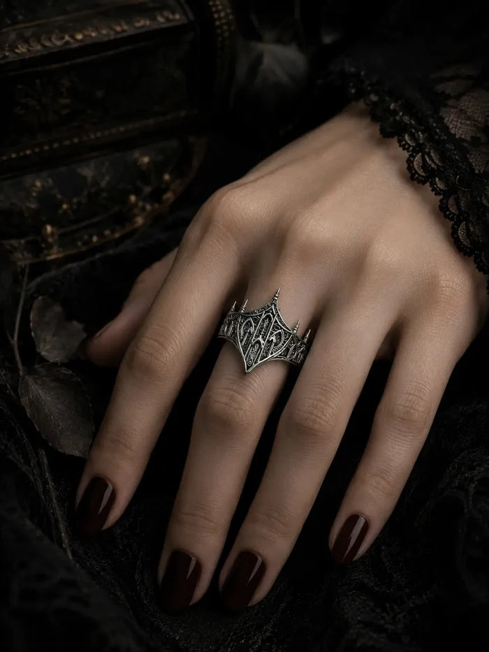Hand wearing gothic sterling silver crown ring — Cathedral Citadel dark sovereignty statement band