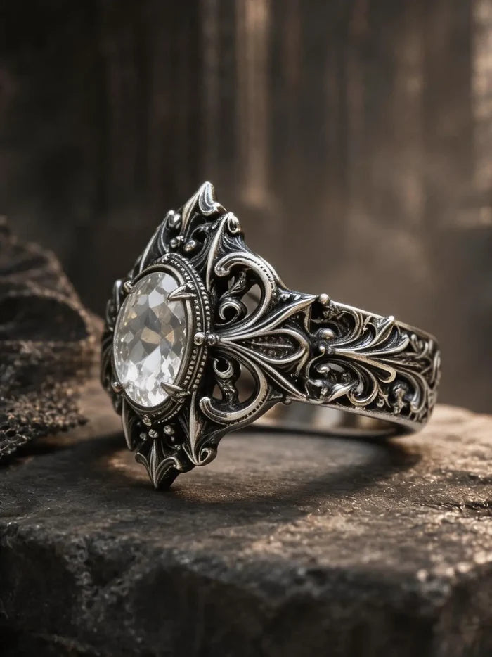 Gothic sterling silver crest ring close-up — white topaz oval stone in talon prong setting