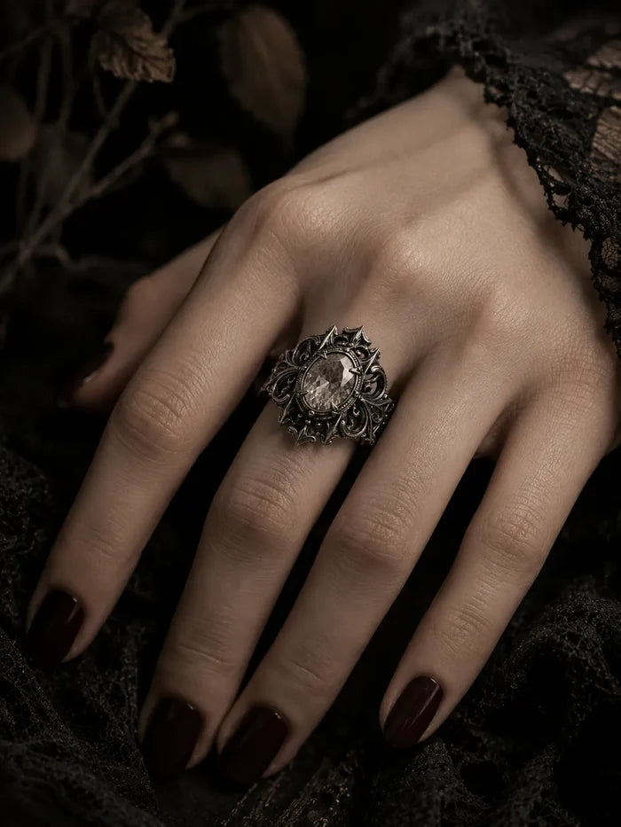 Hand wearing gothic cathedral crest ring with black onyx — 925 silver statement piece on finger