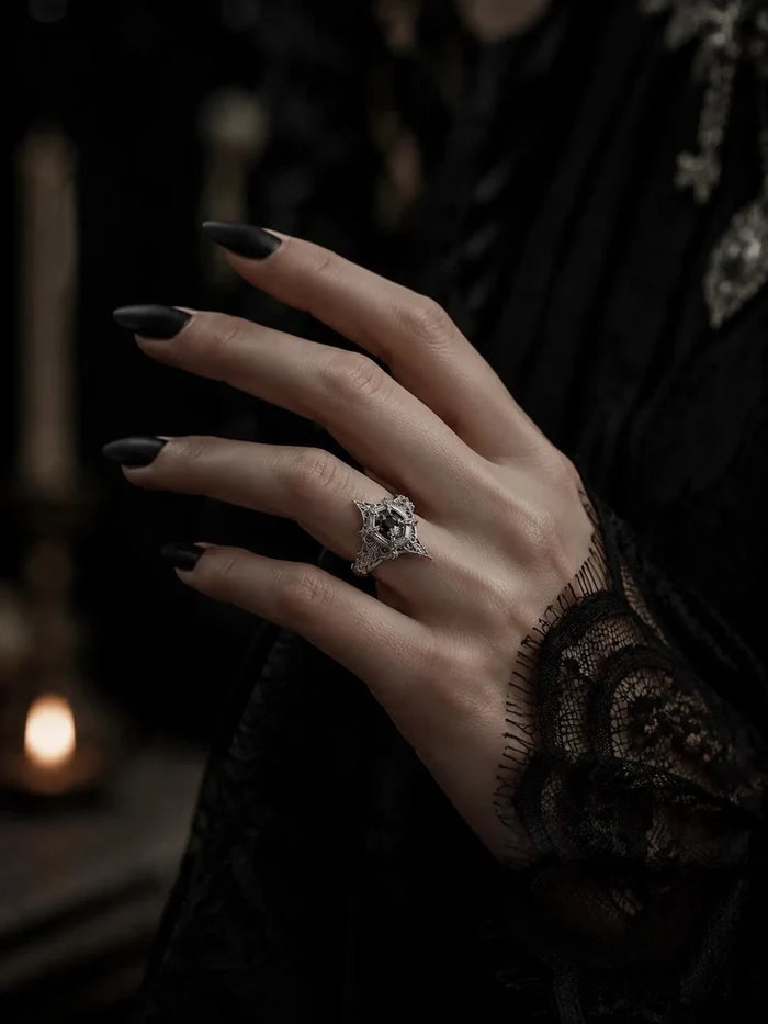 Hand wearing gothic marquise spire ring with white topaz — Dark Academia statement piece, handcrafted silver