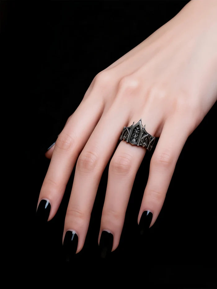 Hand wearing gothic cathedral spire tiara ring — alternative engagement ring with tiara crown profile in 925 silver
