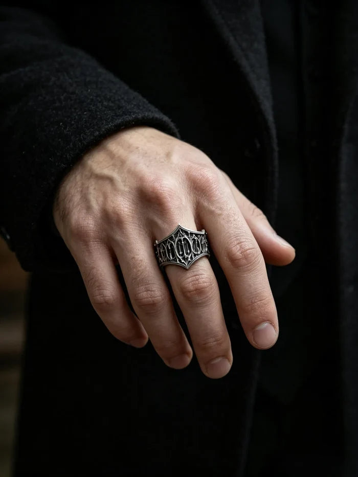 Man wearing the Cathedral Tracery Ring, a carved Gothic sterling silver band