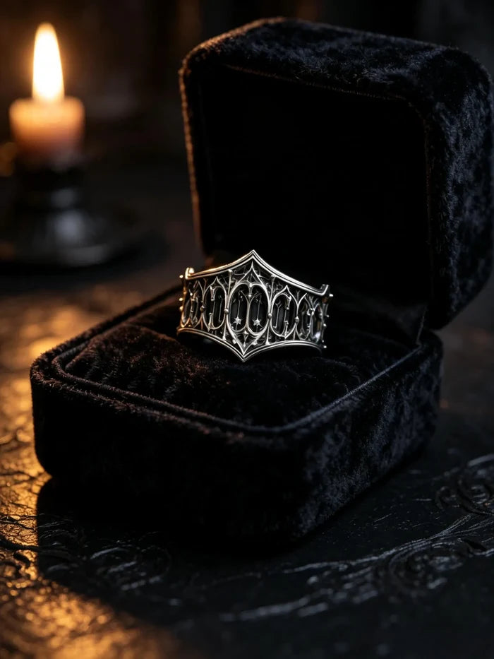 Cathedral Tracery Ring presented in a black velvet ring box by candlelight