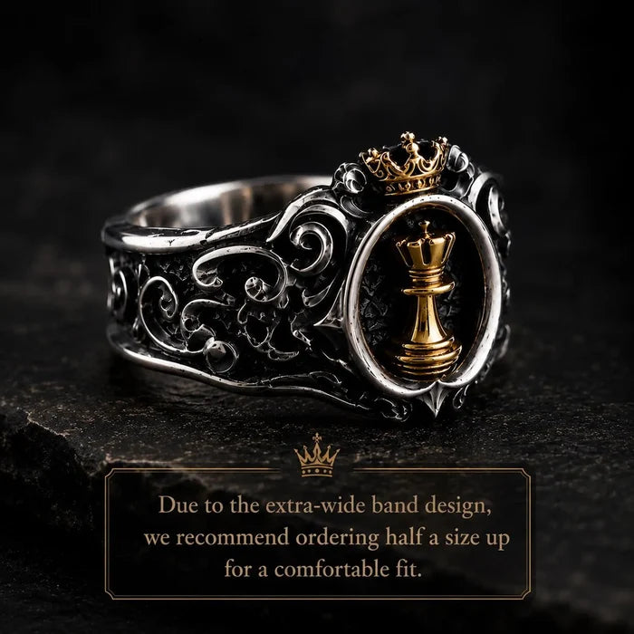 Side view of the Chess Queen Ring's wide oxidized scrollwork band, with a note to order a half-size up for the extra-wide fit