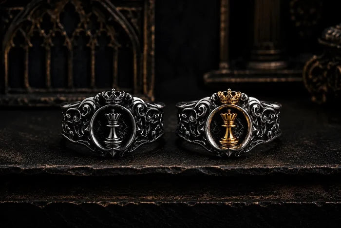 Angled view of the Chess Queen signet ring showing the gold queen, crown and carved sterling silver band
