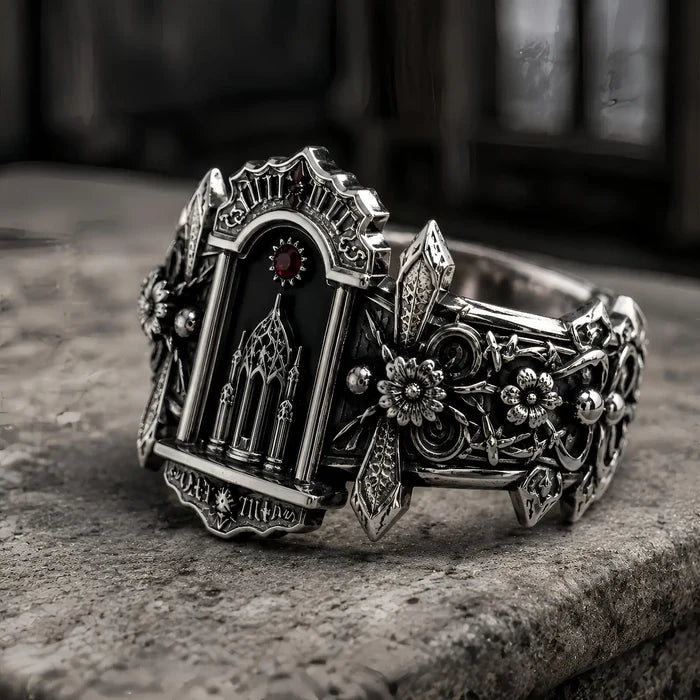 Side detail of the Gothic cathedral ring showing carved lily and rosette shoulders in oxidized 925 sterling silver