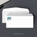 EXIT Realty real estate envelope with subtle house design and return address