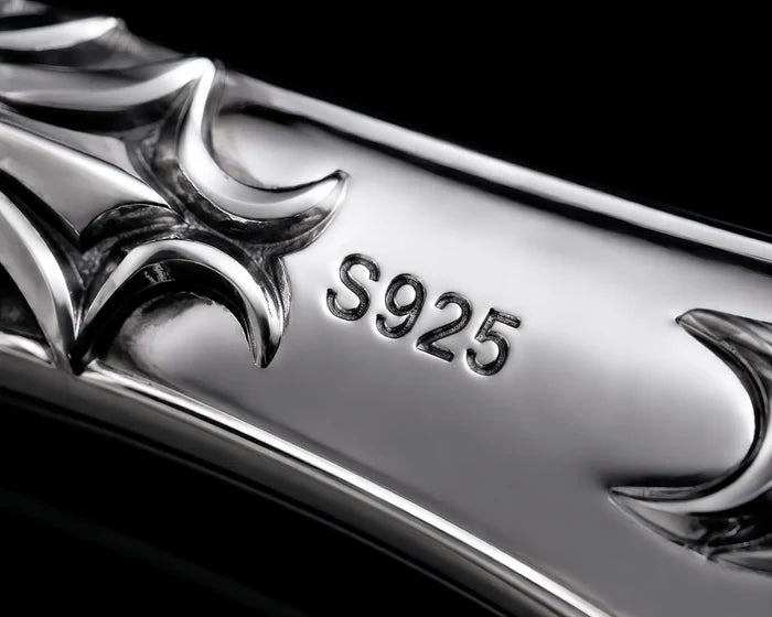 Macro close-up of the sterling silver handle showing the S925 hallmark and cyber-sigilism cutouts
