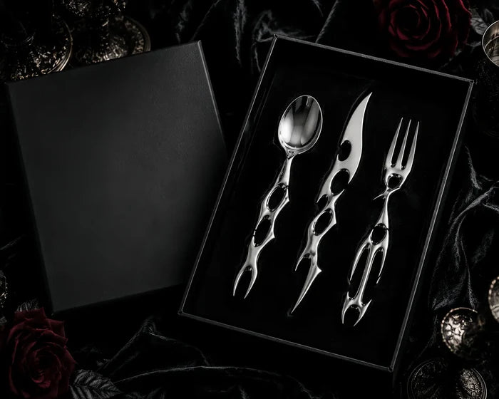 Cyber Baroque cutlery set presented in a black gift box on dark roses — luxury gothic tableware gift