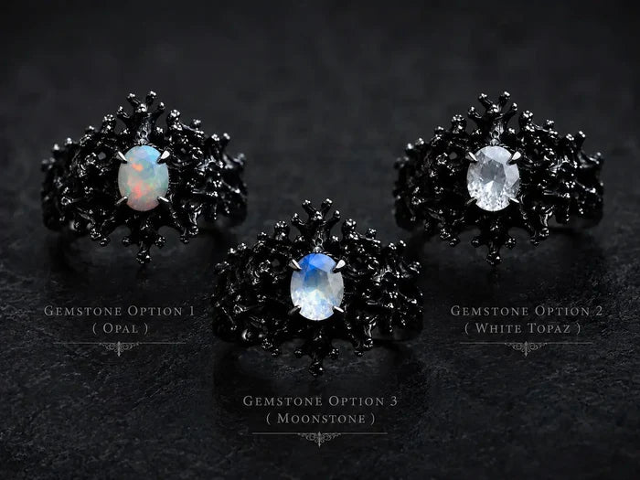 Dark Bloom Ring detail — iridescent oval stone framed by black sterling silver thorns