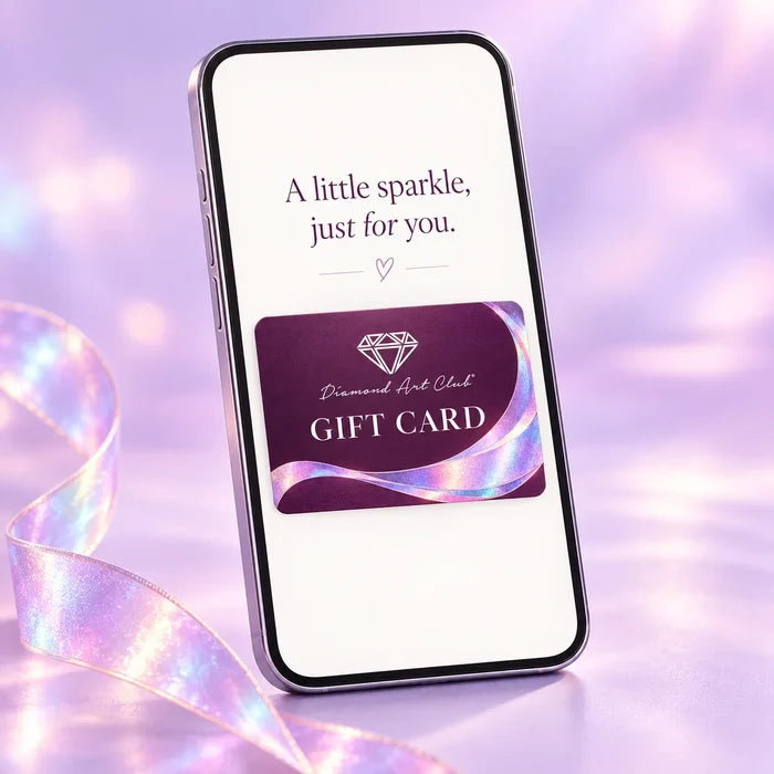 Illustration of a Diamond Art Club digital gift card on a phone. Actual gift card email design may vary.