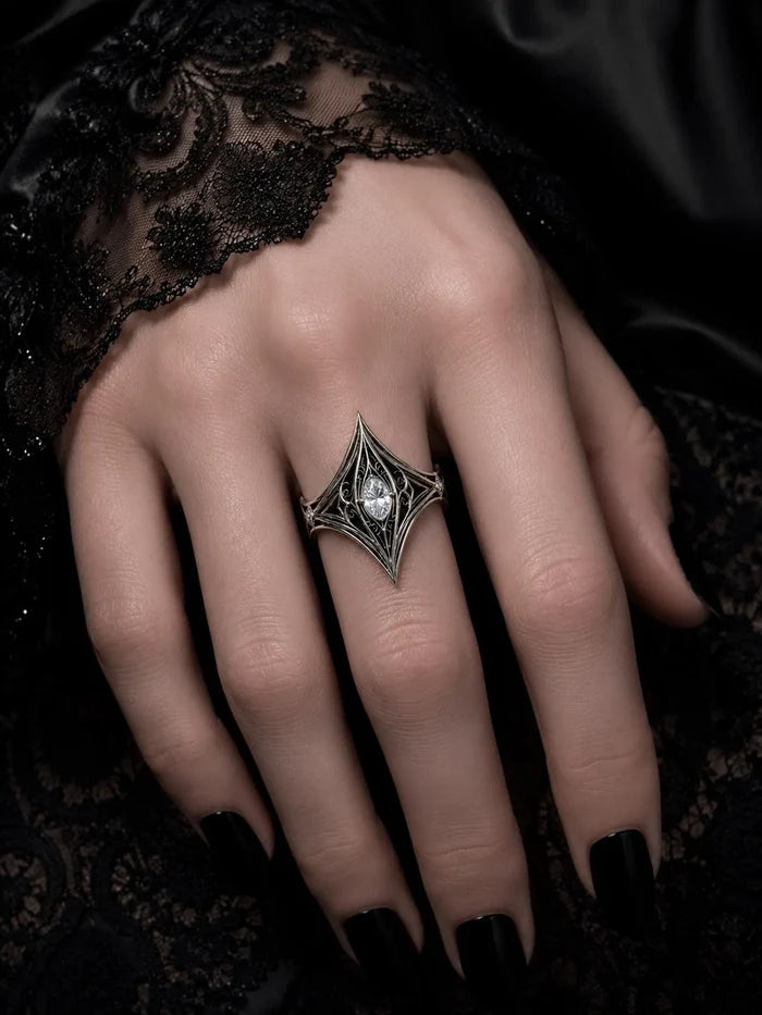 Elven Tear Ring worn on the hand, showing the filigree spire and marquise center stone