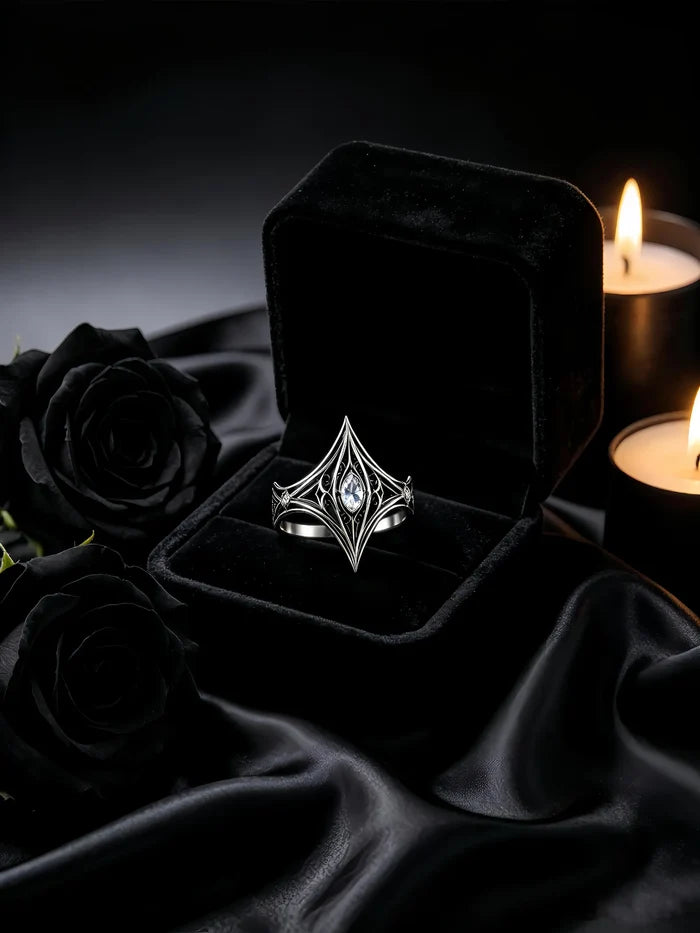 Elven Tear Ring presented in a black velvet ring box with candles and black roses