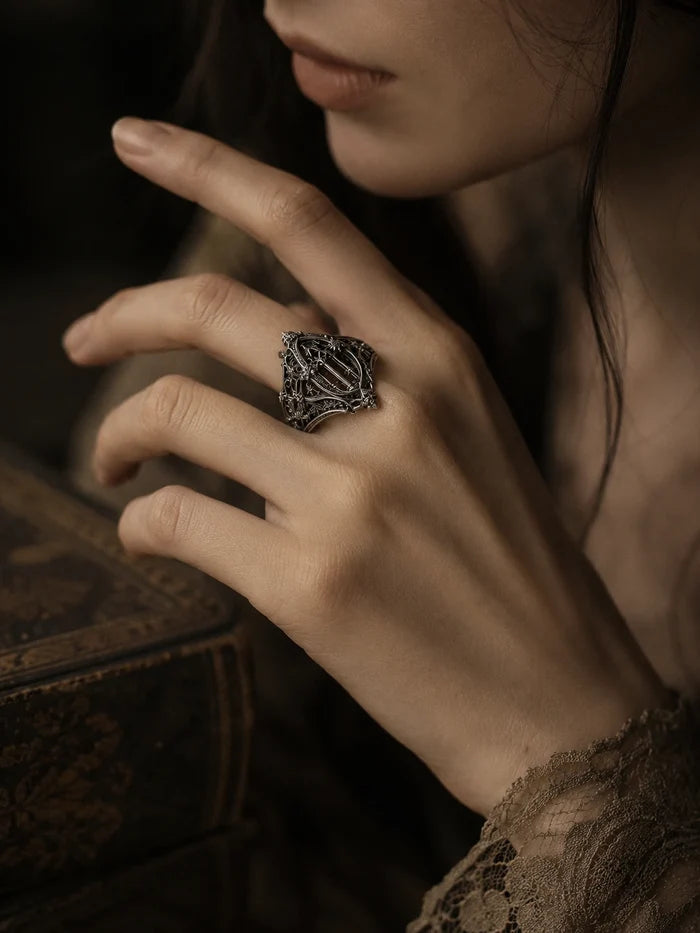 Hand wearing gothic sterling silver cathedral ring — dark romantic Gothic Academia statement piece