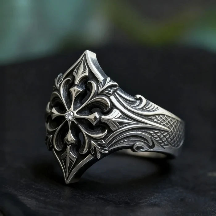Fleur-de-lis ring close-up — 2mm moissanite center stone in gothic cross setting, oxidized silver