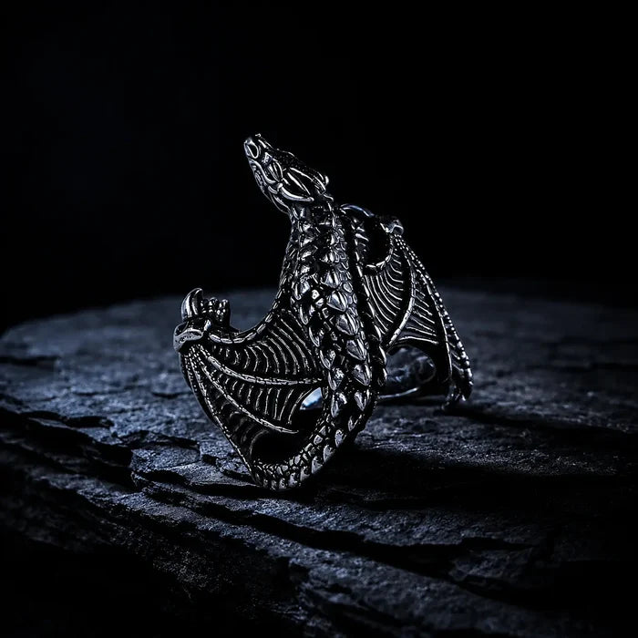 Close-up of Frost Dragon Ring scales and clawed feet detail in oxidized silver