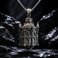 Sterling silver Cathedral Lantern Gothic pendant necklace on a chain against dark rock