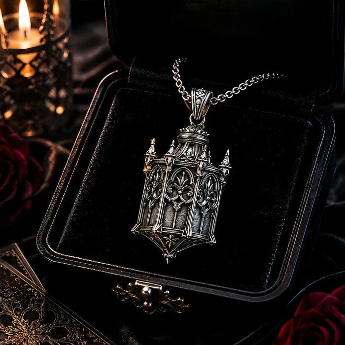 Cathedral Lantern Gothic pendant necklace displayed in a black velvet jewelry box with red roses
