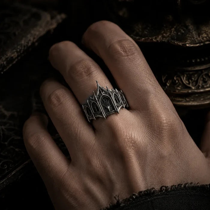 Hand wearing gothic sterling silver coronet ring — men's dark academia statement piece