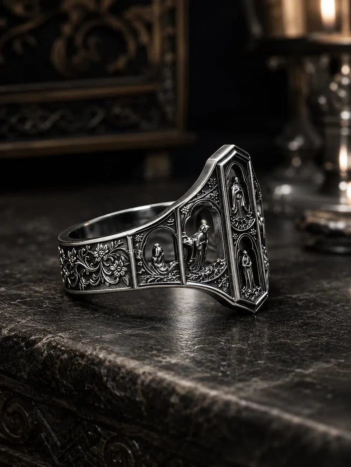 Side profile of the Saints Prayer signet ring showing the floral-tracery band and Gothic arched niches in sterling silver