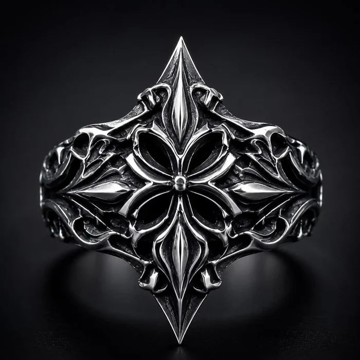 Lozenge shield ring close-up — heraldic fleur-de-lis cross motif in deep-relief oxidized sterling silver