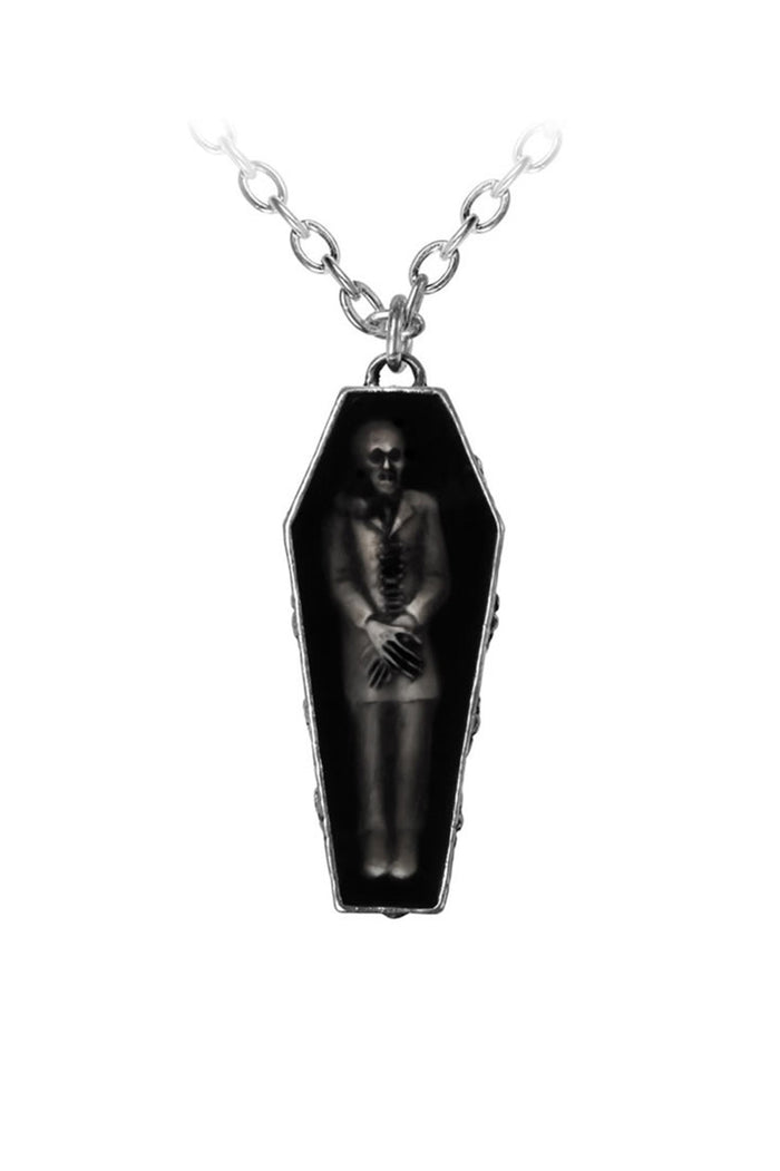 Coffin-shaped pendant with a vampire inside on a white background