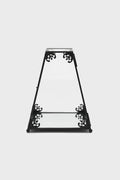 Decorative black metal terrarium case with intricate designs on a white background