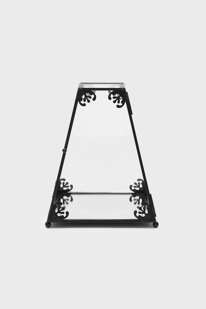 Decorative black metal terrarium case with intricate designs on a white background