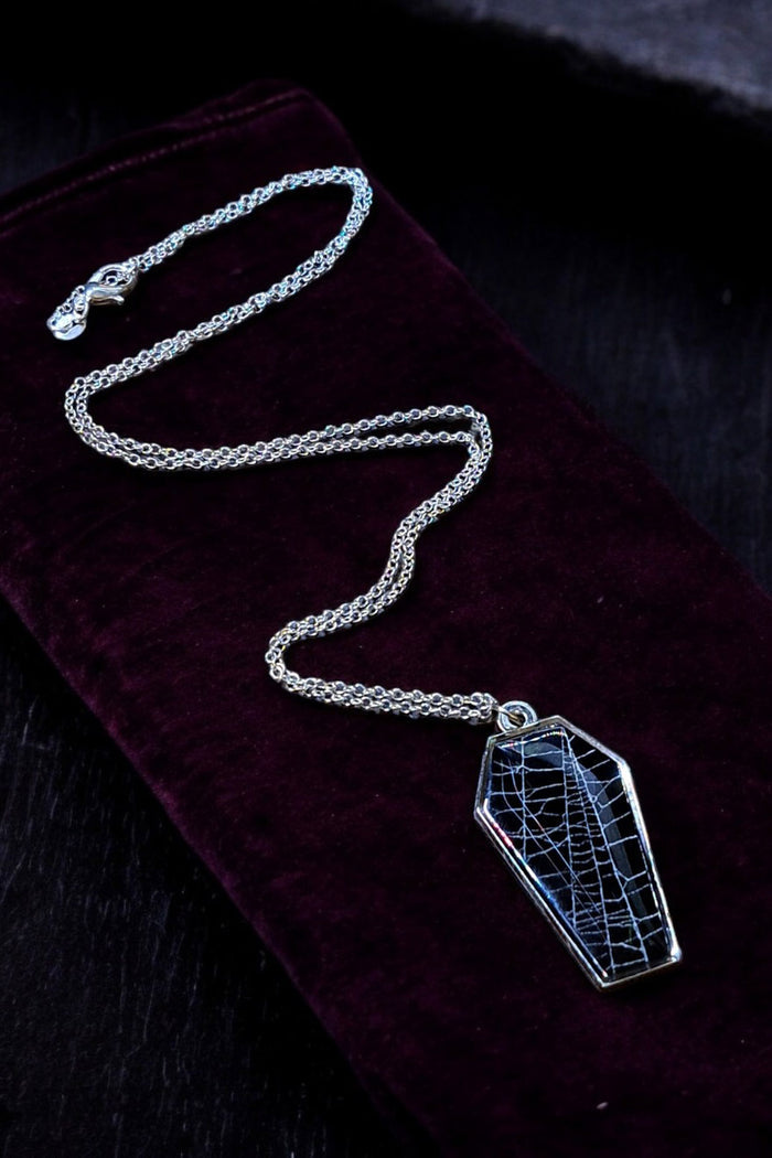gothic coffin necklace with a real spiderweb inside
