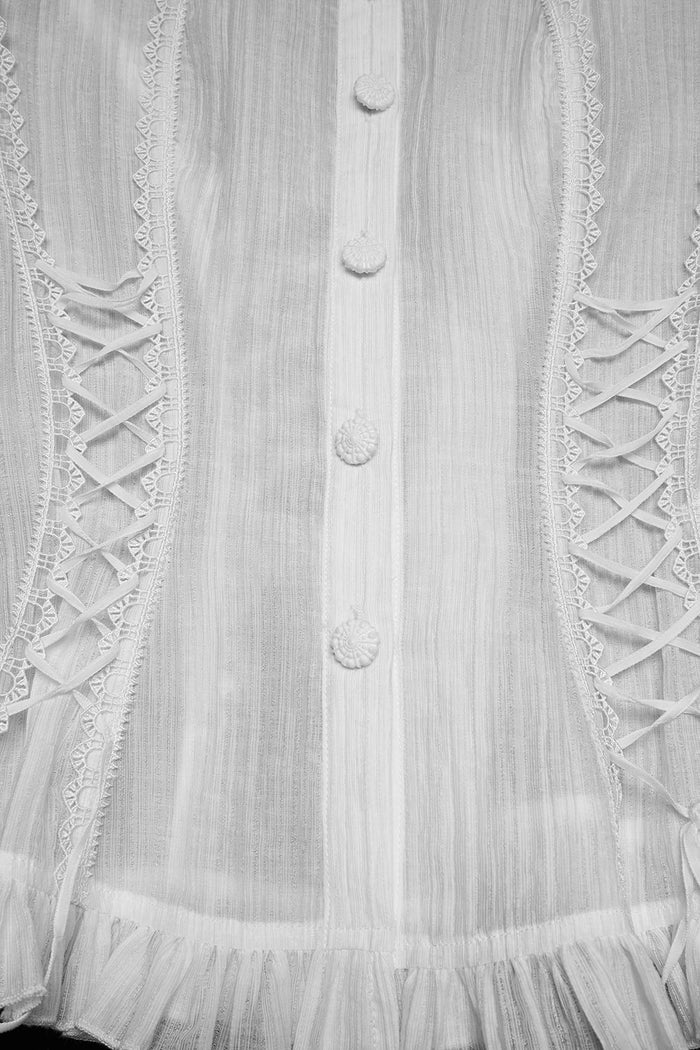 lace up ruffled hem blouse
