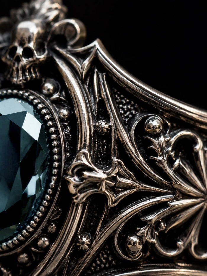 Victorian skull ring close-up — hand-sculpted skull motifs and chiaroscuro oxidized Baroque scrollwork